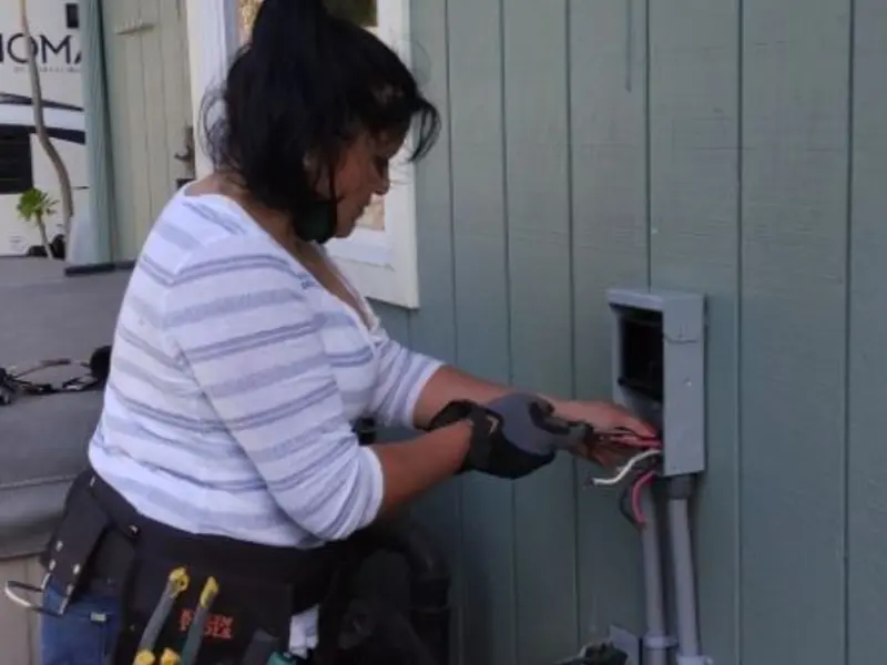 Licensed electrician wiring an exterior subpanel in Cloverly