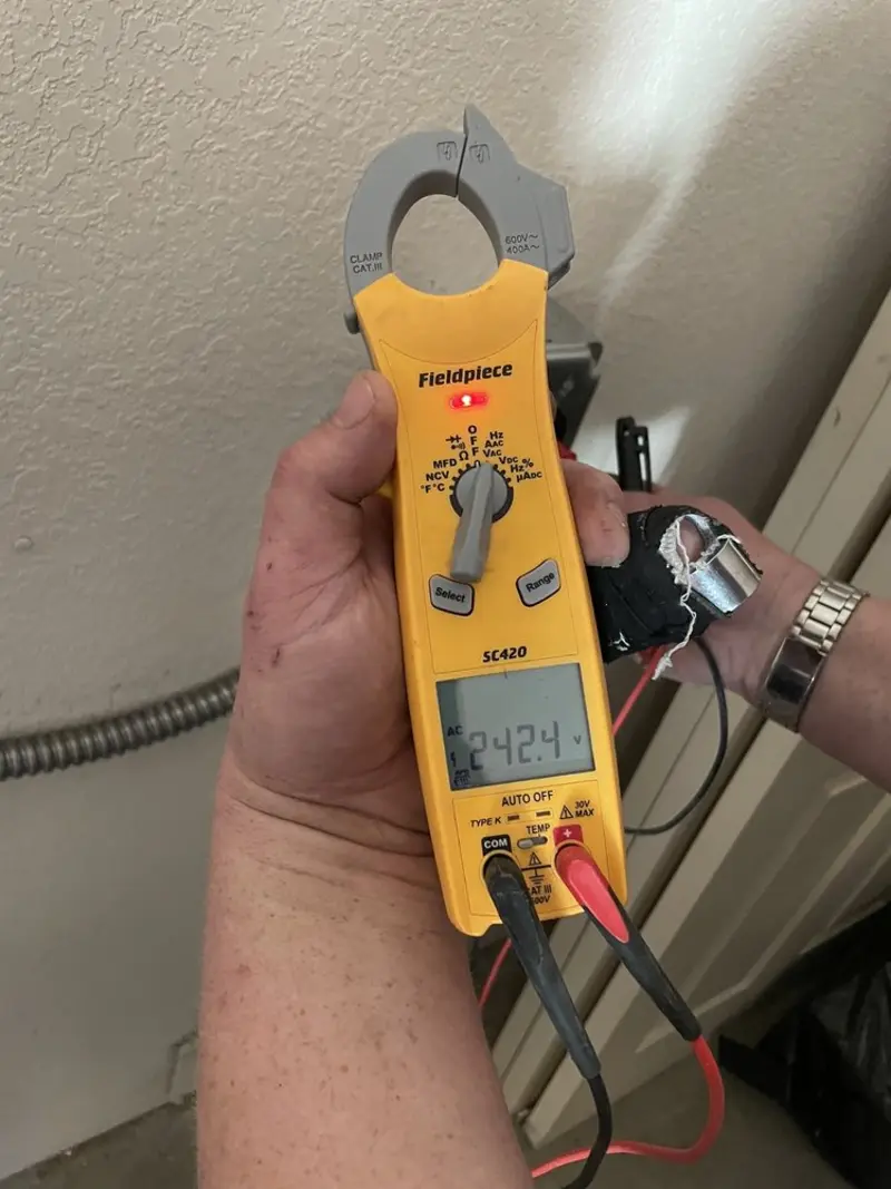 Voltage testing with clamp meter during Ceiling Fan Installation in Cloverly